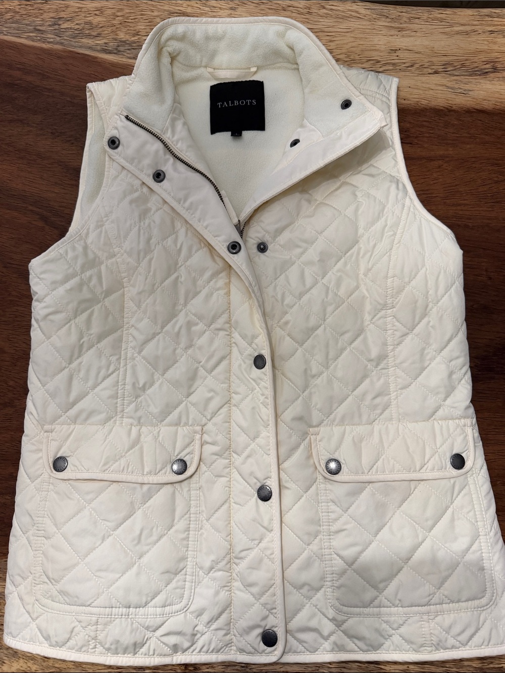 Talbots diamond-quilted vest featuring a front zip closure with a snap placket